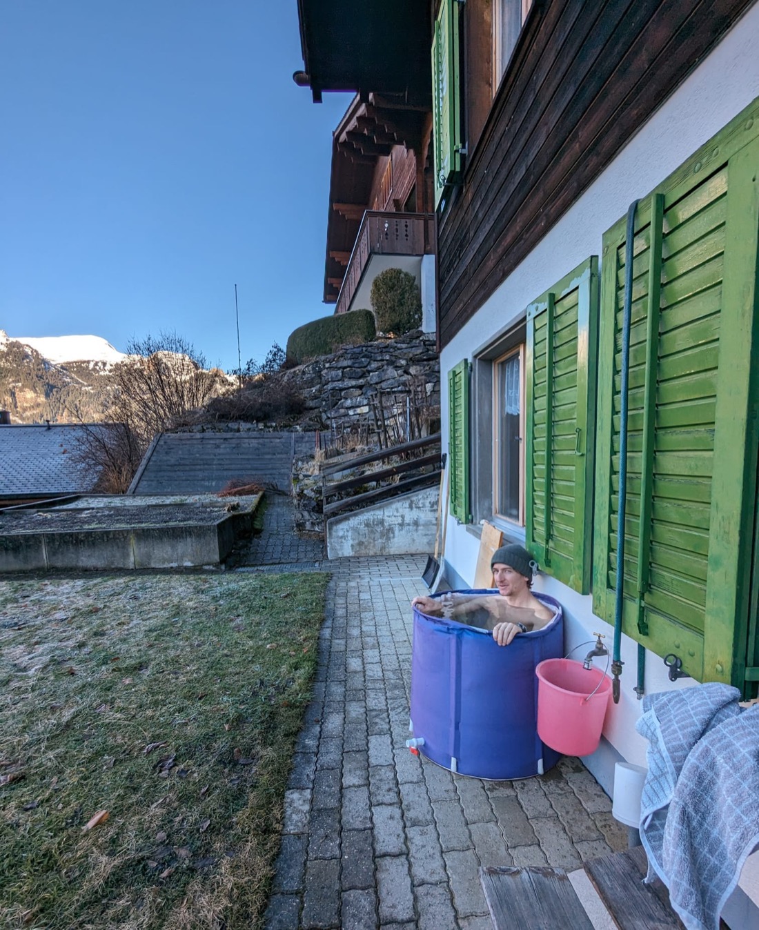 Cold plunge in a barrel in the Alps
