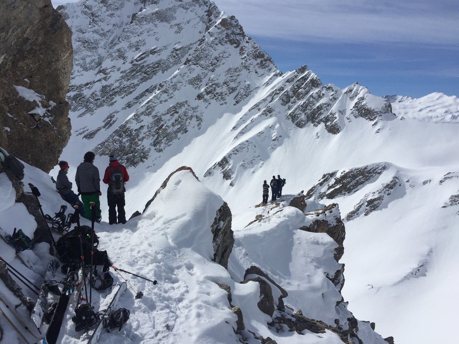 Riders on a snowy ridge above Courmayeur